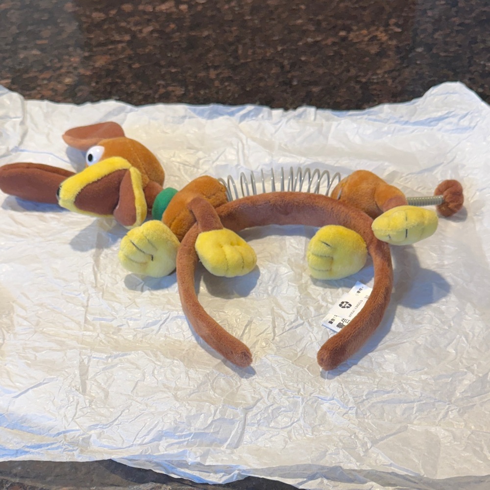 Slinky Dog plush ear headband for adults.  Pre-owned but never used.